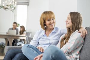 Parent Reassuring Teenager About Driving